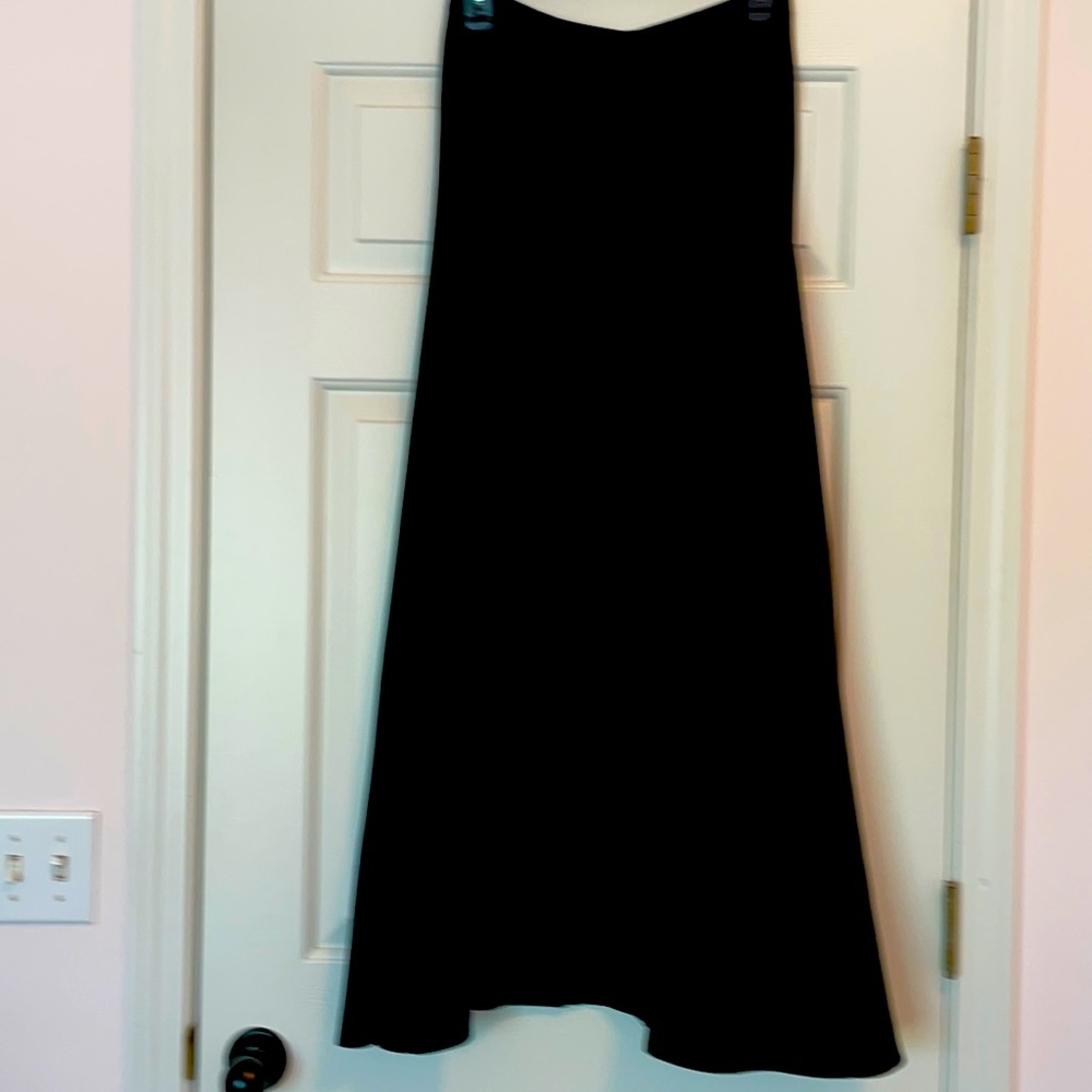 Black taffeta maxi skirt with 2 pleats in the front. Size medium